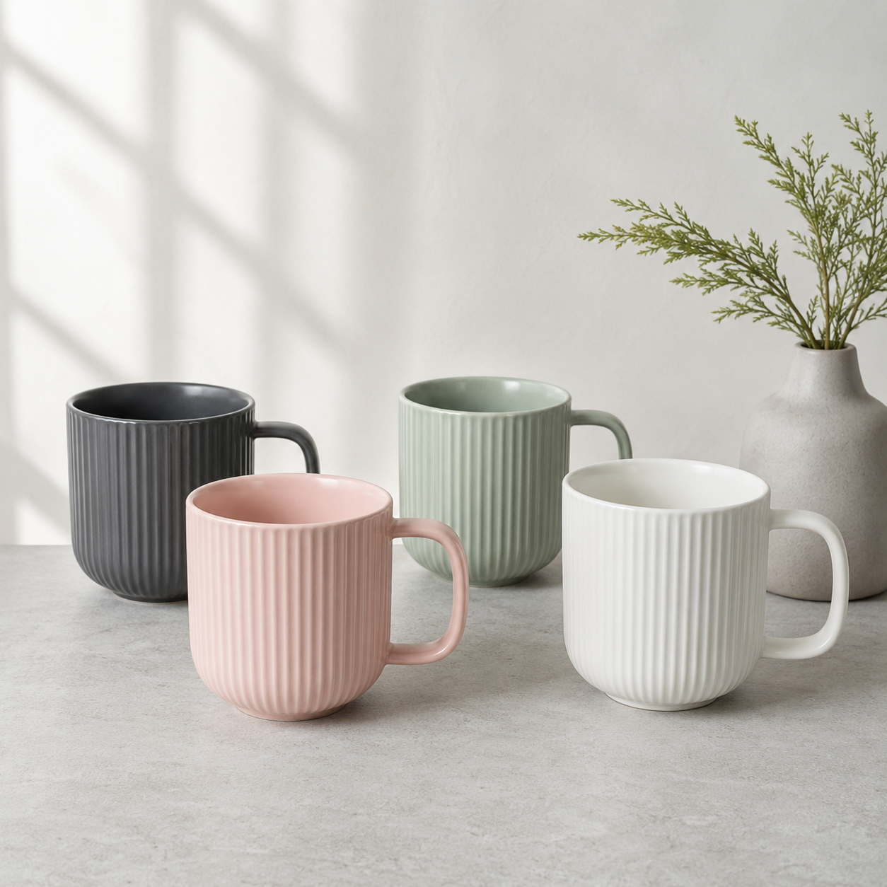 Ribbed ceramic mugs in soft neutral colors